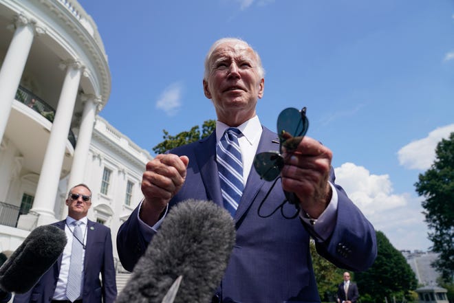 President Joe Biden speaks to members of the media before walking to board Marine One on the South Lawn of the White House, Friday, Aug. 26, 2022, in Washington. (AP Photo/Evan Vucci) ORG XMIT: DCEV429