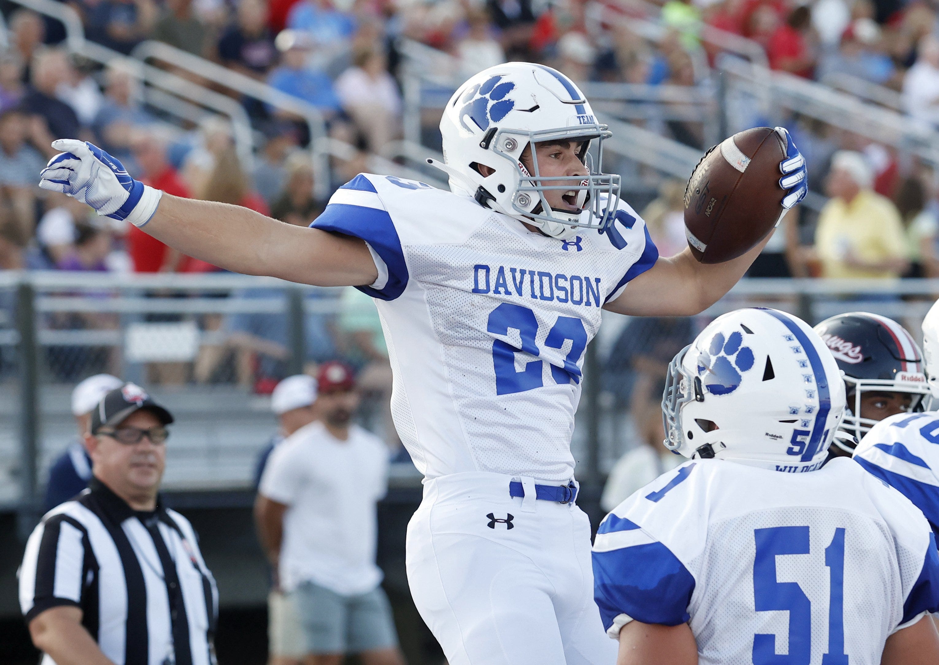 Hilliard Davidson's James Tarantine (23) celebrates his touchdown against Grove City with teammate Payton Long (51) during the first quarter of a high school football game at Grove City High School Friday, Aug. 26, 2022. 