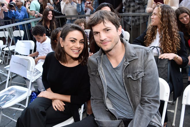Ashton Kutcher (right) with his wife Mila Kunis. The celebrity power couple have two children together. Last month Kutcher revealed that he lost his vision, hearing and equilibrium for a year while battling a rare form of vasculitis.