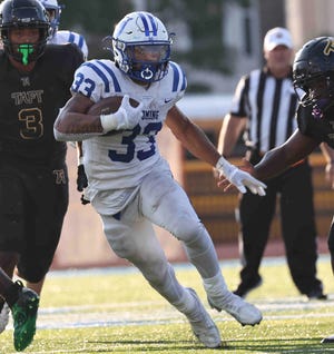 Wyoming running back C.J. Hester runs the ball during the football game between Taft and Wyoming high schools  Friday, Aug. 26, 2022.