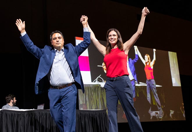Lt. Gov. candidate Shane Hernandez and gubernatorial candidate Tudor Dixon at supporters on stage during the MIGOP State Nominating Convention at the Lansing Center in Lansing on August 27, 2022.