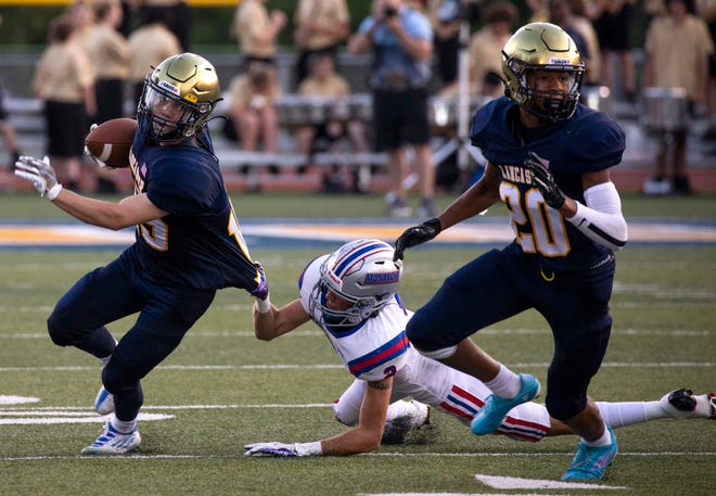 Lancaster's David Roby (15) tries to evade the clutches of a Marysville defender during the Golden Gales Week 2 17-0 loss at Fulton Field. Lancaster will travel to Olentangy on Friday.