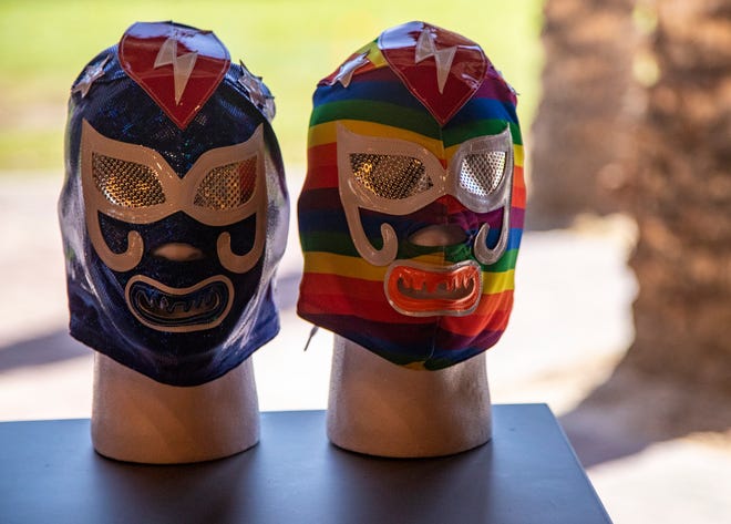 Máscaras de luchador hechas a medida en exhibición en Luchador Brewing Company en Cathedral City.