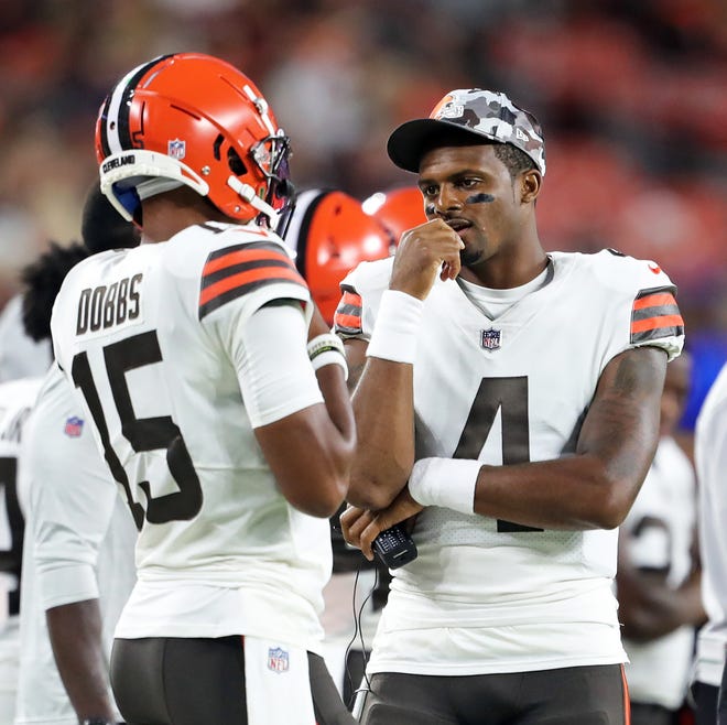 Cleveland Browns quarterback Deshaun Watson (4) talks with Cleveland Browns quarterback Joshua Dobbs (15) during the first half of an NFL preseason football game against the Chicago Bears, Saturday, Aug.  27, 2022, in Cleveland, Ohio.
