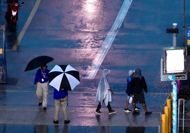 Umbrellas and ponchos have been the official gear of NASCAR race day today at Daytona.