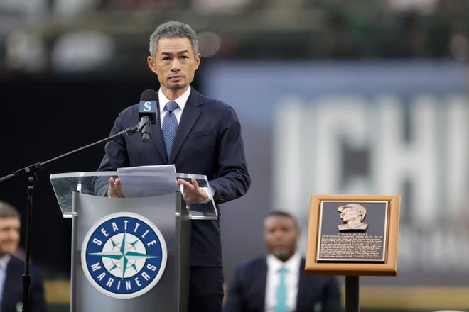 Former Seattle Mariners player Ichiro Suzuki speaks as he is inducted into the Mariners Hall of Fame during a ceremony before a baseball game between the Mariners and the Cleveland Guardians, Saturday, Aug. 27, 2022, in Seattle. (AP Photo/John Froschauer)