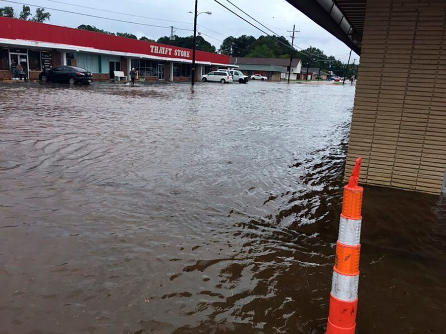 In this photo provided by Pastor Bryant May, rain water covered Bierdeman Road in Pearl, Miss., Wednesday, Aug. 24, 2022.