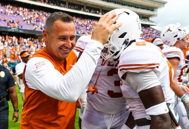 Oct 2, 2021; Fort Worth, Texas, USA; Texas Longhorns head coach Steve Sarkisian laughs with defensive back D'Shawn Jamison (5) after the game against the TCU Horned Frogs at Amon G. Carter Stadium.