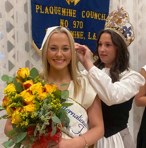 2021 Evangeline Isabella LoBue passes the title to Anna Catherine Bradford, who was named 2022 Evangeline during a social Saturday night at the Knights of Columbus Council 970 Home in Plaquemine.