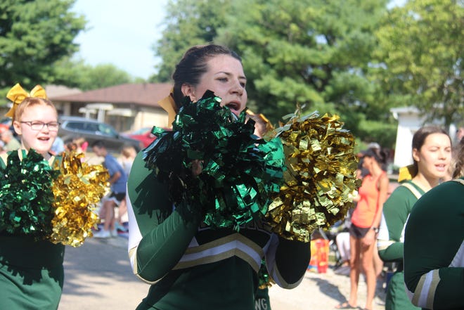 Woodward-Granger High School cheerleaders lead a cheer during the Granger Days parade on Saturday, Aug. 27, 2022.