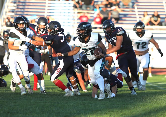 Organ Mountain running back Abraham Romero, number 22, carries the ball Friday, Aug. 26, 2022, in Deming. Romero would lose consciousness between plays later in the game, sending him to the hospital.
