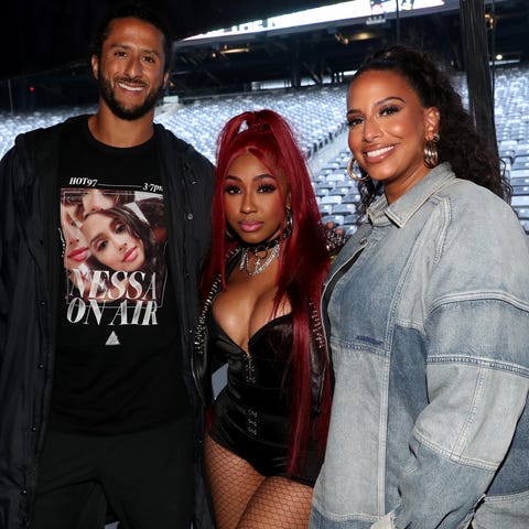 Colin Kaepernick and Nessa (right) pose with Yung 