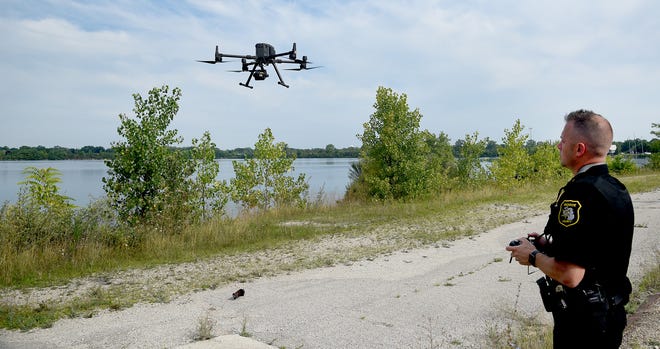 Monroe County Sheriff's Capt. Dave Raymond flies the department's drone over Lake Monroe, formerly France Stone Quarry, to take photographs of makeshift campsites and trash left behind by squatters and trespassers. The years-long problem with trespassers has eased, but remains an issue.
(Photo: Tom Hawley, The Monroe News)