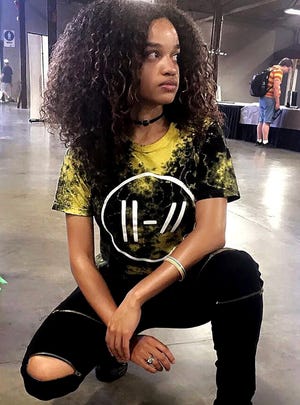 Nia Ramsey, 23 and wearing a twenty one pilots shirt, poses during a June 2019 A-Kon convention. A-Kon, one of the largest anime conventions that rallies every year in Texas, was cancelled due to the pandemic in 2020 and 2021, but Ramsey hopes to attend next year.