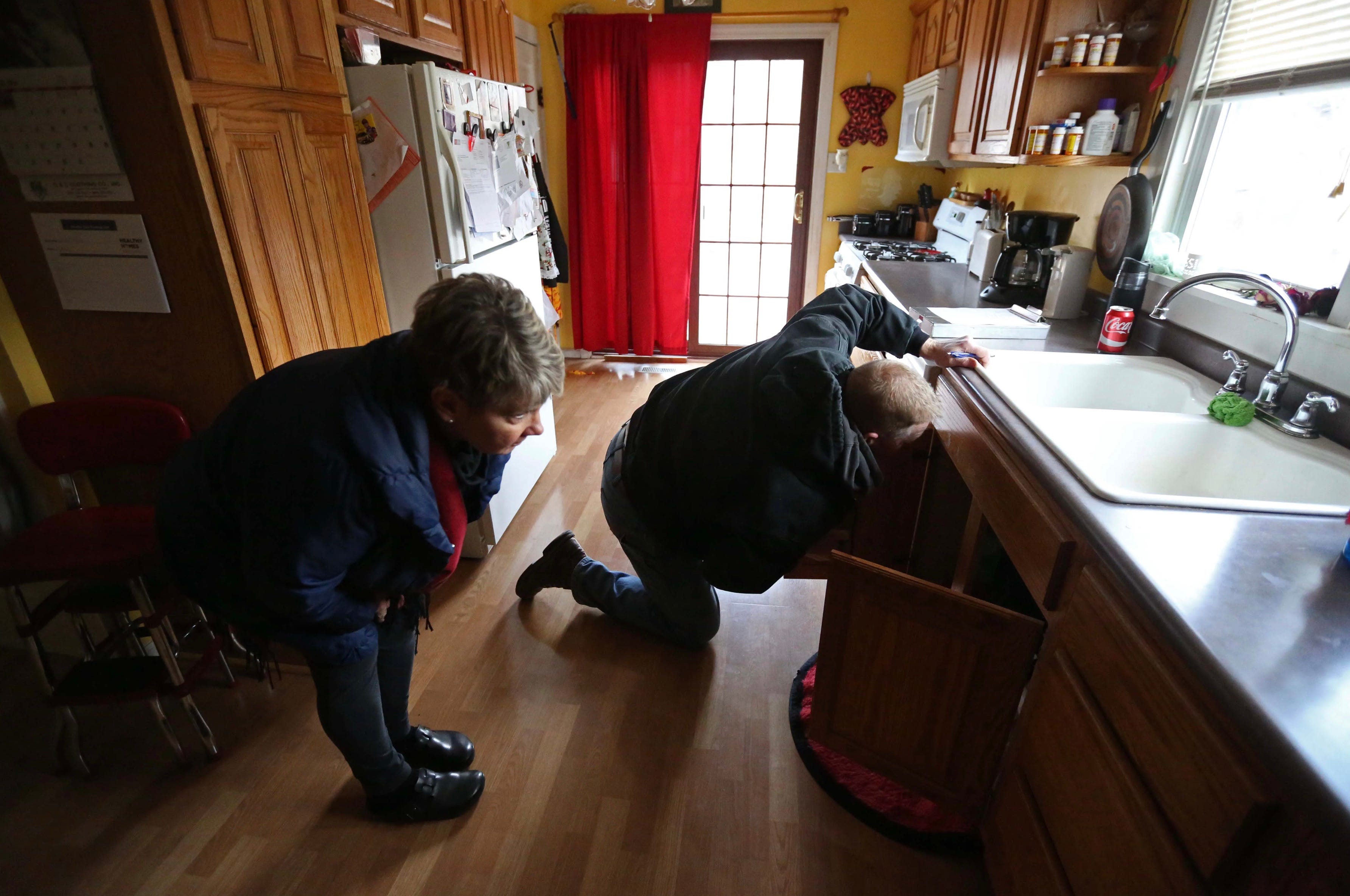 Carolyn Schaefer, a registered nurse and healthy homes specialist, and Mike Miller, a city of Des Moines code enforcement officer inspect a home for environmental causes of asthma March 1, 2016, in Des Moines. In 2016, Des Moines, Iowa, launched a program to find and fix household problems that contribute to childhood asthma. It was supported by Polk County and the city’s three main hospital companies, Mercy, UnityPoint and Broadlawns.