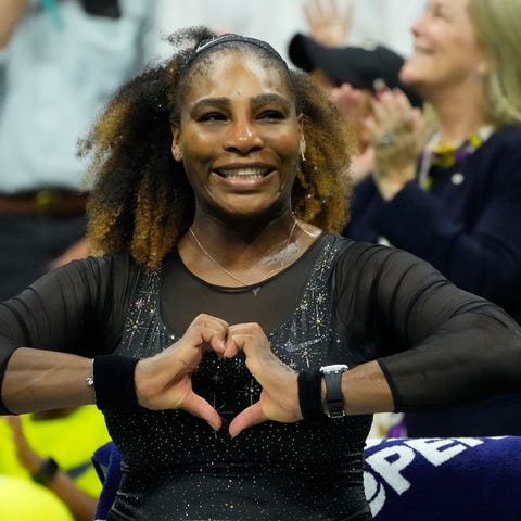 Serena Williams watches a fan tribute after she be