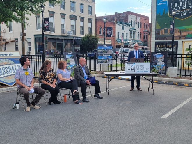 Downtown Honesdale received a Keystone Communities Main Street designation from the Department of Community and Economic Development on Tuesday, August 30. Seated left to right: Honesdale Mayor Derek Williams, Sandi Levens (Greater Honesdale Partnership), Julie Fitzpatrick (Pennsylvania Downtown Center) and Rick Vilello (DCED). Standing: Paul Macknosky (DCED).