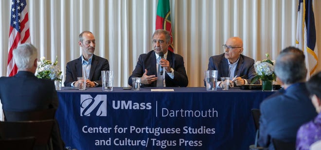 Azores Regional Government President Jose Manuel Bolero delivers his remarks during a special event in New Bedford to celebrate the creation of the Tagus Press' Belles Azurica book series.  Also seen in the photo are Dr. Mario Pereira, co-editor of the book series (left), and Dr. Francisco Cota Fagundes, who translated the series' opening volume.