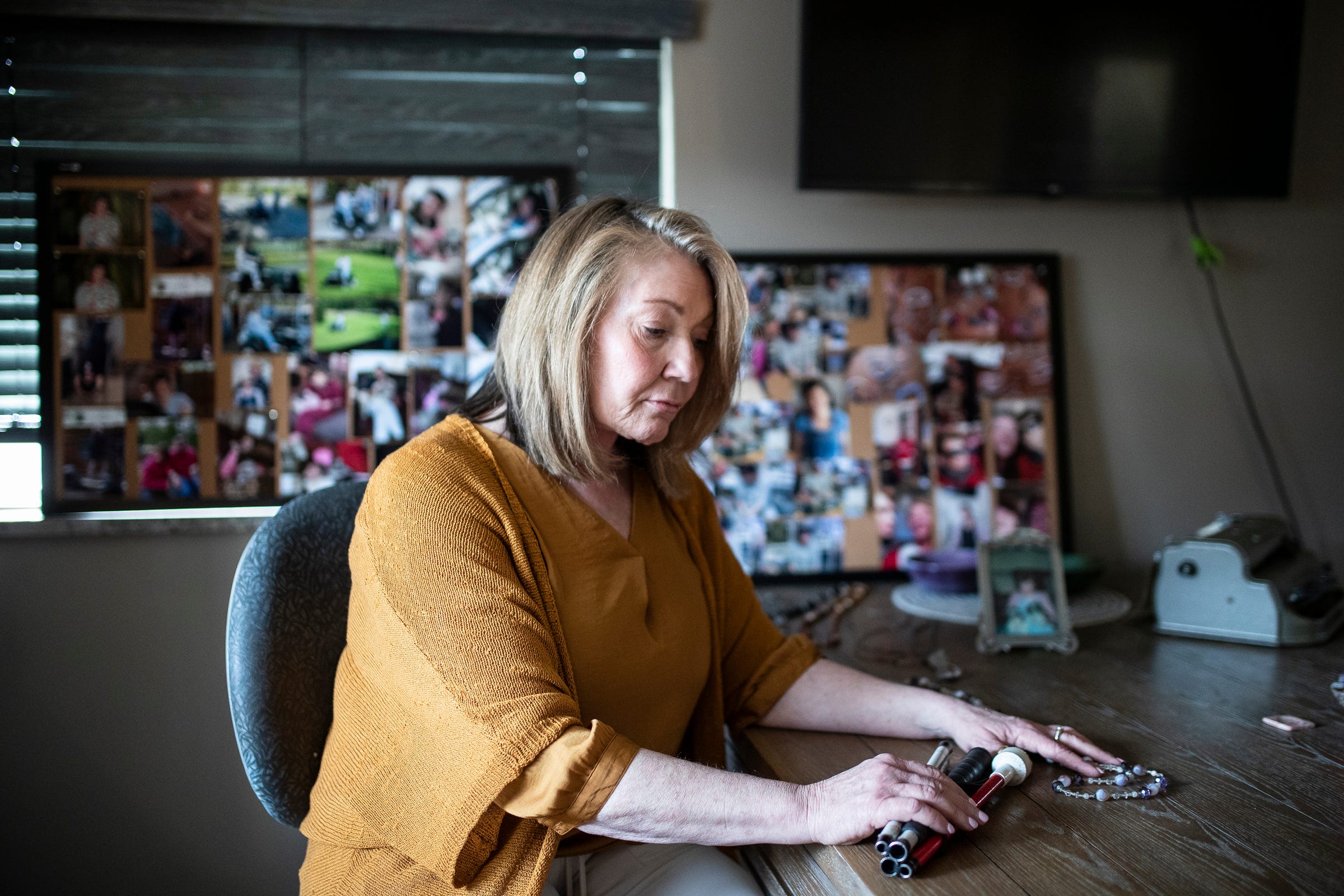 Lois Mulkey looks at the belongings of her late daughter, Bridget Cavanagh, in Southgate on Tuesday, March 29, 2022.