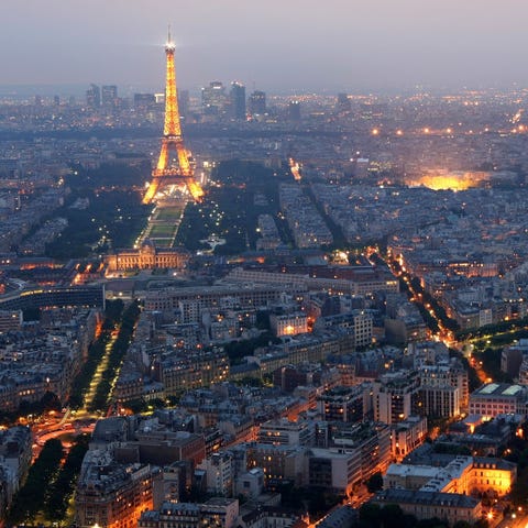 Paris sparkles at dusk in this file photo from Jun