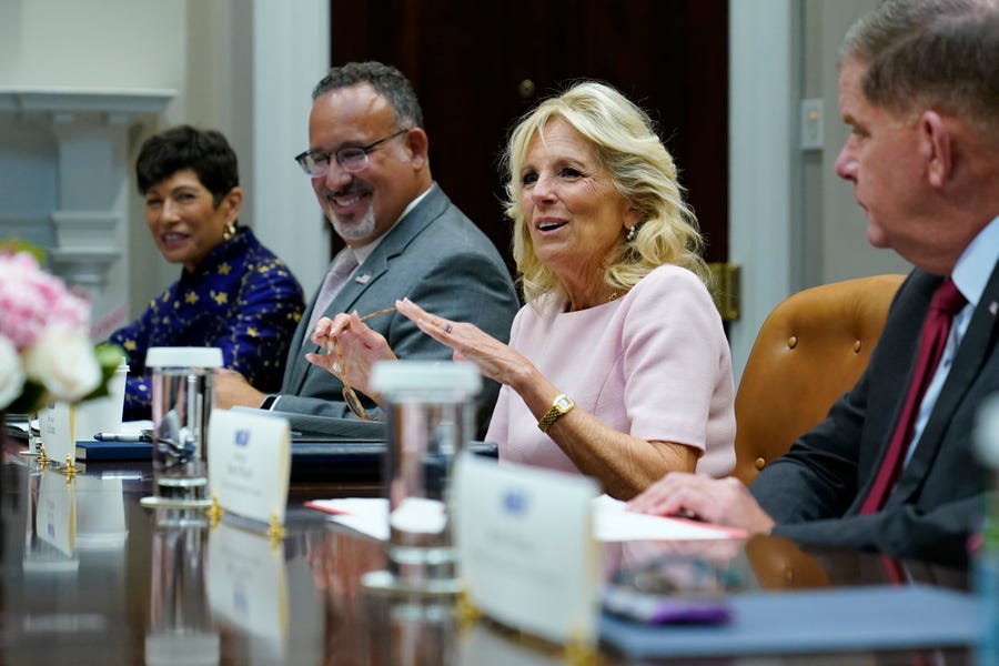 First lady Jill Biden, second from right, speaks during a meeting with, from left, American Association of Colleges for Teacher Education President Lynn Gangon, Education Secretary Miguel Cardona, and Labor Secretary Marty Walsh, during a meeting on ways to support schools in an effort to address teacher shortages as the new school year begins.