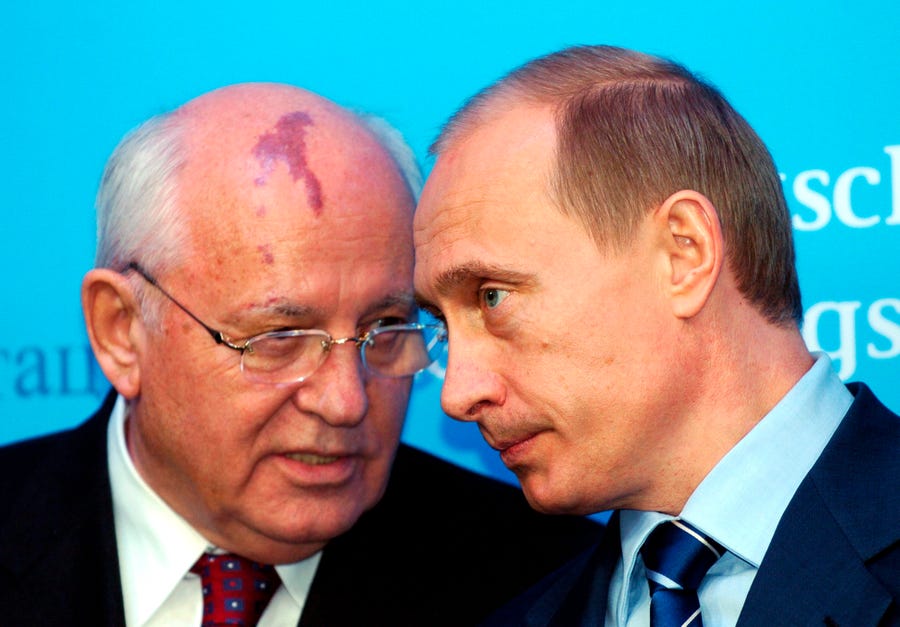 Russia's President Vladimir Putin, right, talks with former Soviet President Mikhail Gorbachev at the Castle of Gottorf in Schleswig, northern Germany, Tuesday, Dec. 21, 2004. Russian news agencies are reported that former Soviet President Mikhail Gorbachev died at 91 on Tuesday.