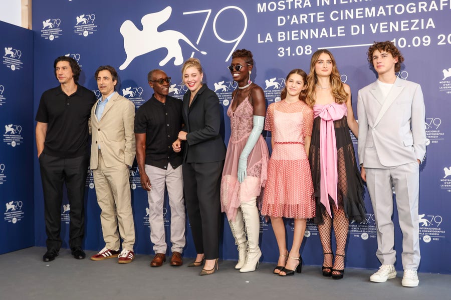 Adam Driver, from left, director Noah Baumbach, Don Cheadle, Greta Gerwig, Jodie Turner-Smith, May Nivola, Raffey Cassidy, and Sam Nivola pose for photographers at the photo call for the film 'White Noise' during the 79th edition of the Venice Film Festival in Venice, Italy, Wednesday, Aug. 31, 2022. (Photo by Joel C Ryan/Invision/AP) ORG XMIT: LENT156