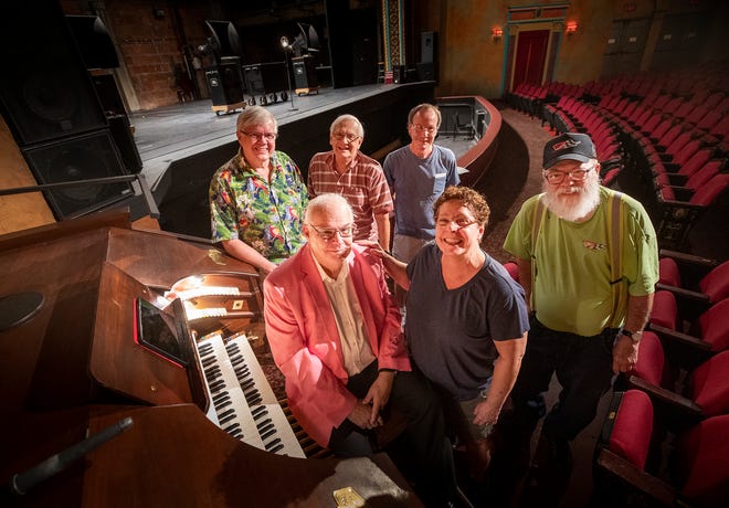 Kim Martin, sitting at the organ, has been playing theater organ since he was a kid. He's been playing it before movies at the Polk Theatre in Lakeland since 2014. Helping to keep the organ in playing shape are organ crew members, front row, Denise Anderson and Pete Theisen, and, back row from left, George Anderson, Bob Siegel and Gary Blais.