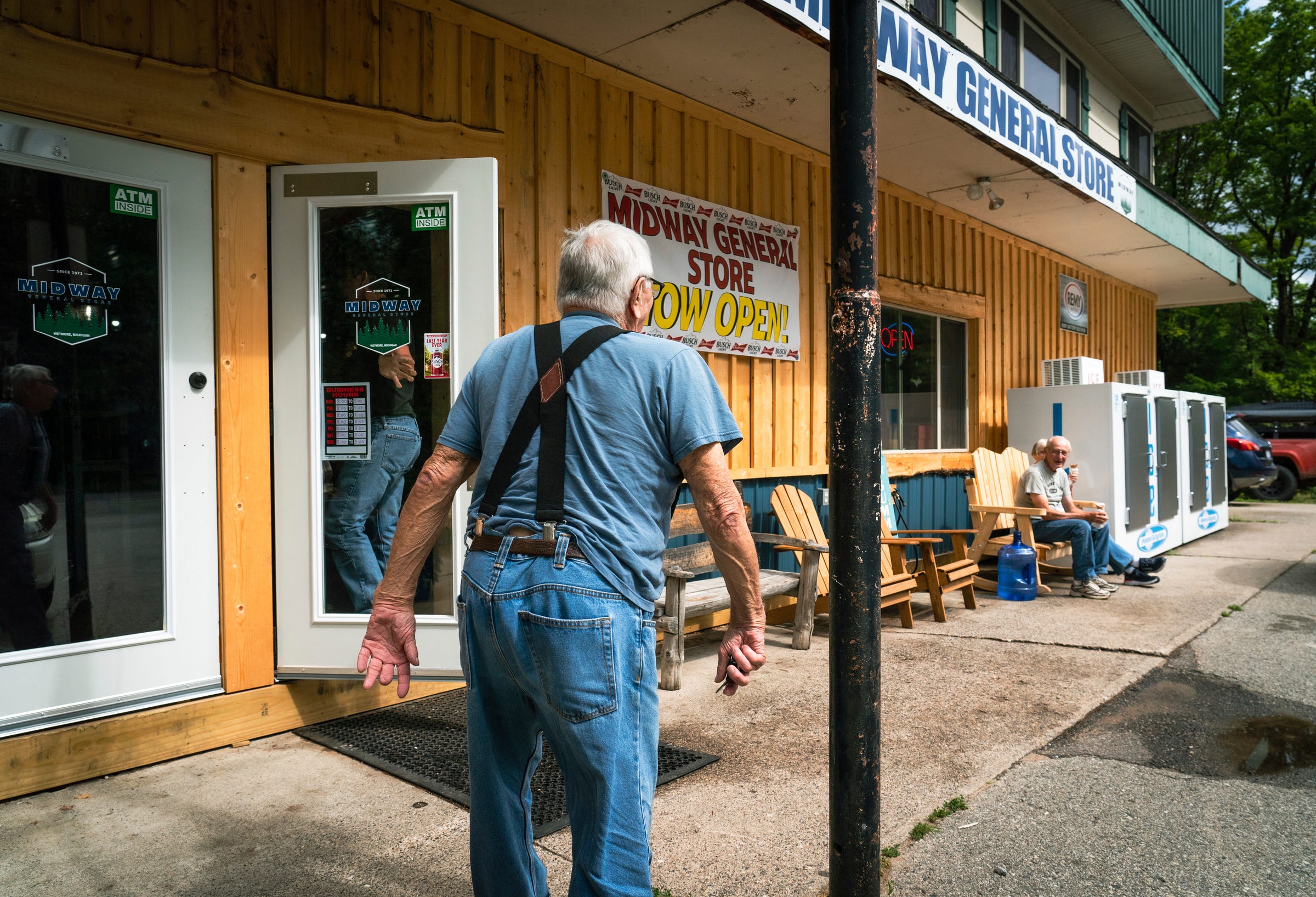 Mailman Ron Curtis, 86, makes his way into Midway General Store in Wetmore, which he once owned along with five hunters' cabins, in Wetmore in Michigan's Upper Peninsula on Wednesday, July 27, 2022.