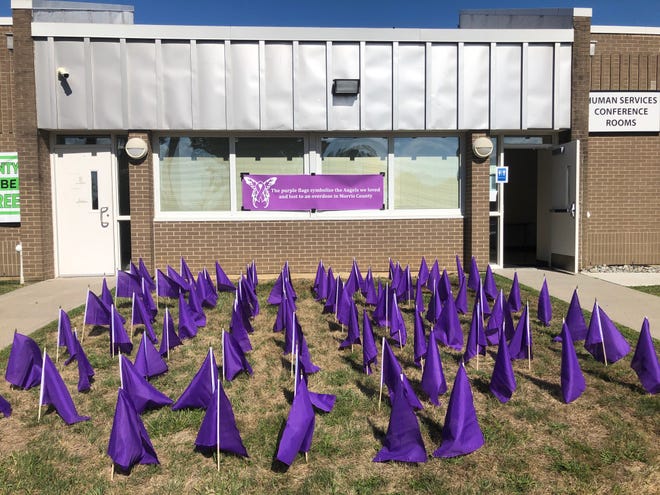 Purple flags symbolizing Morris County residents lost to drug overdoses fly outside the Morris County Addiction Center during a ceremony recognizing International Overdose Awareness Day Wednesday, Aug. 31, 2022.