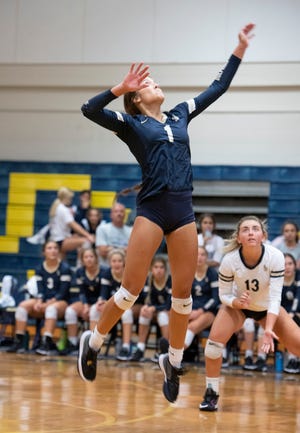 Gulf Breeze High's Camryn Brooks (No. 1) sets up for the kill during Wednesday's match against Sneads High. Gulf Breeze defeated Sneads in three straight. 