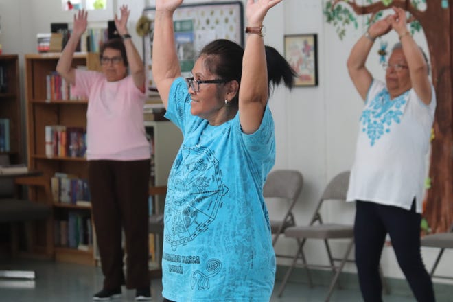 Seniors participate in a Zumba fitness program at the Paradise Park activity center.