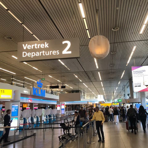 A fairly empty check-in area at Amsterdam Schiphol
