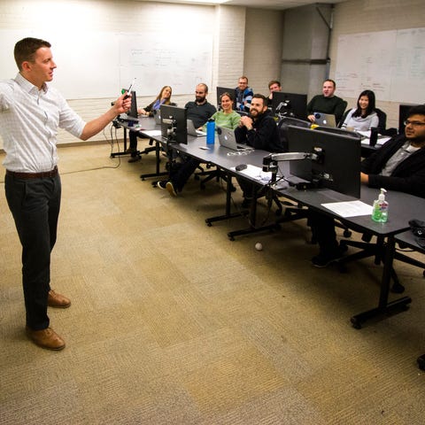 An instructor teaches to a cohort of Tech Elevator