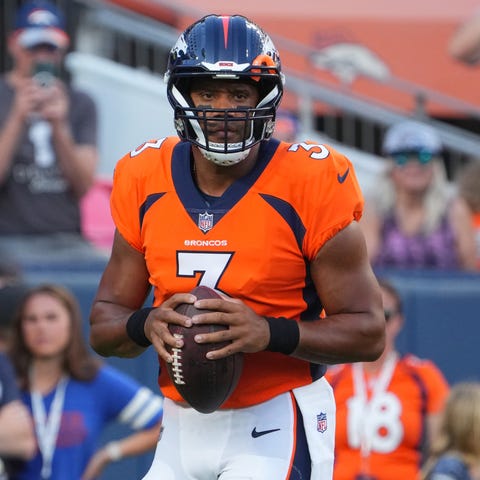 Denver Broncos quarterback Russell Wilson warms up