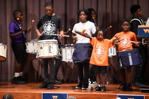 FILE - Created 2 Play drumline performs before the Warnock for Georgia rally at Augusta Technical College on Thursday, Sept. 1, 2022. The organization's co-owner Christina Harris said they try to involve the kids in these activism events because they are the future generation.