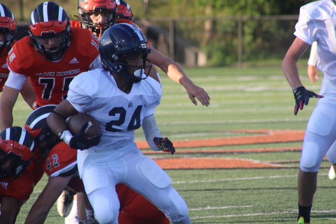 Montreal Reid, shown rushing in a game against Belding in September, and Lakewood can boost their playoff hopes with a victory over rival Ionia this week.