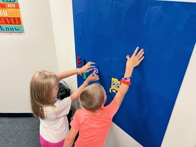 Students add to a Lego wall at East Jordan Elementary School's STEM room. The school introduced a new STEM class this year, giving students an opportunity to tackle challenges hands-on.