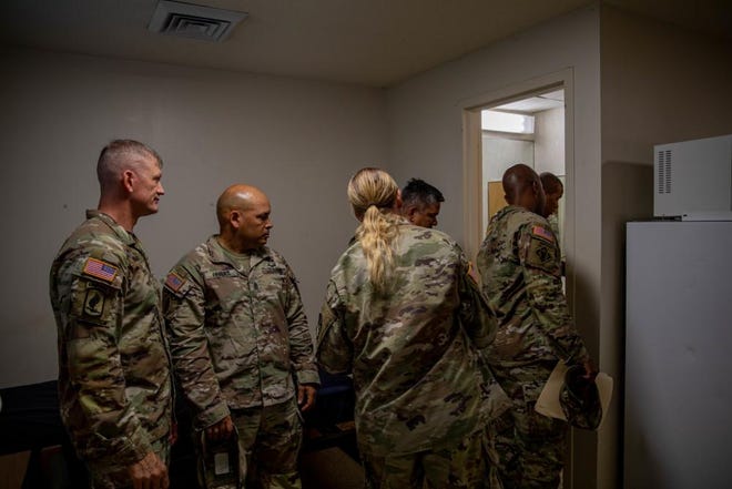 Command Sgt. Maj. Thomas Holland, the senior enlisted advisor of the 18th Airborne Corps, inspects a barracks bathroom with other senior leaders Tuesday, Aug. 30, 2022, in the  525th Military Intelligence Brigade barracks at Fort Bragg. Soldiers in Smoke Bomb Hill barracks are in the process of moving into other barracks on the installation.