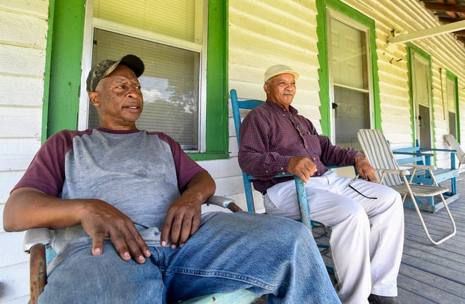 Barry Harrell, left, and his brother Lorenzo Tolbert at their families farmhouse near Marion Junction, Ala., on Monday August 29, 2022.