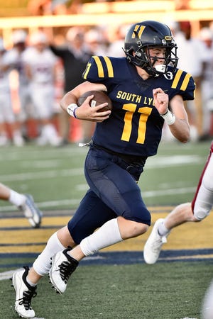 South Lyon's Braden Fracassi rushes during a Lakes Valley Conference football game against Milford on Thursday, Sept.  1, 2022.