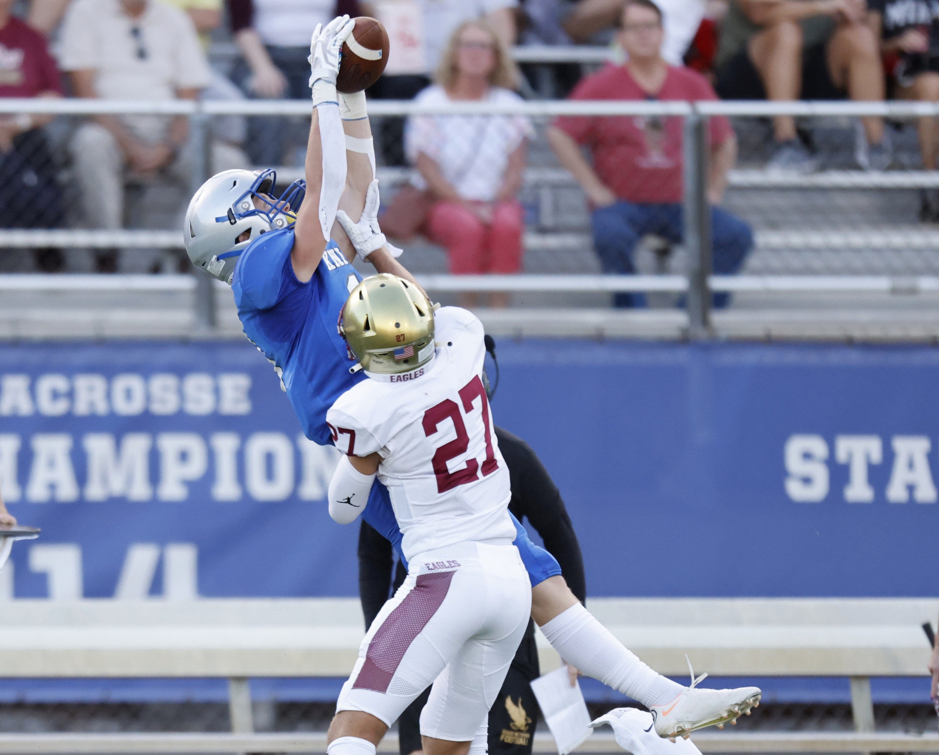 Ready's Dalton Miller makes a catch against Watterson's Brandon Trout on Sept. 2.