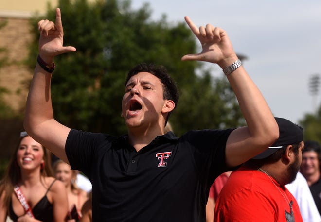 A Texas Tech fan gestures "guns up" before the game against Murray State, Saturday, Sept. 3, 2022, at Jones AT&T Stadium.