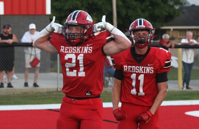 Coshocton's Riley Woodie celebrates a catch against Maysville.