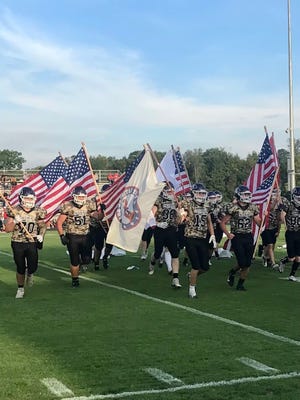 Mount Gilead's football team takes the field before playing Elgin earlier this year. The Indians have earned a spot in the 2022 playoffs with two weeks left in the regular season.
