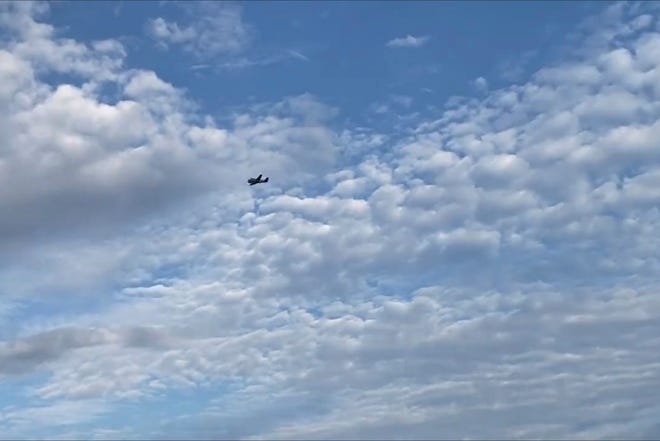 A small airplane circles over Tupelo, Miss., on Saturday, Sept. 3, 2022. Police say the pilot of the small airplane is threatened to crash the aircraft into a Walmart store. The Tupelo Police Department said that the Walmart and a nearby convenience store had been evacuated.