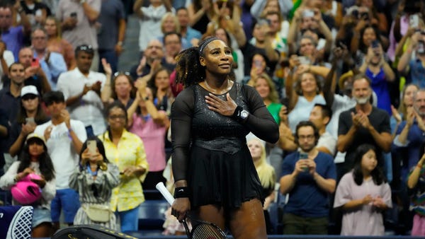 Serena Williams salutes the crowd after her third 