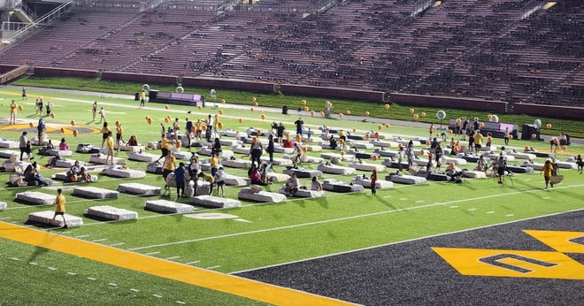 One hundred twin beds are placed on Faurot Field.  They were given to children who needed them through a partnership of Love Columbia, the Veterans United Foundation and Ashley Furniture's Hope to Dream program.