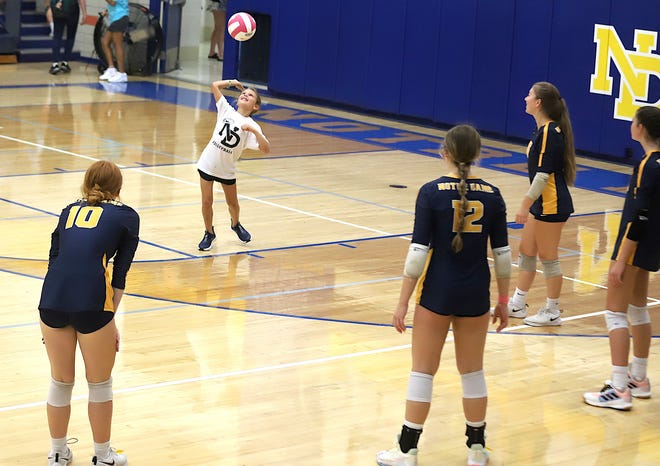 Notre Dame’s Grace Reid hits around with the team between games Saturday at the Notre Dame Nikes Invitational in Burlington.