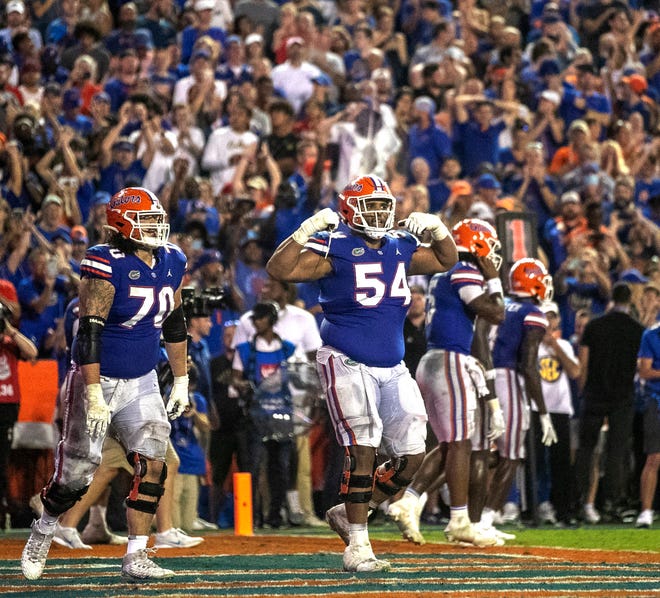 Florida Gators offensive lineman O'Cyrus Torrence (54) celebrates the touchdown by Florida Gators quarterback Anthony Richardson (15) in the second half at Steve Spurrier Field at Ben Hill Griffin Stadium in Gainesville, FL on Saturday, September 3, 2022. [Cyndi Chambers/Gainesville Sun]